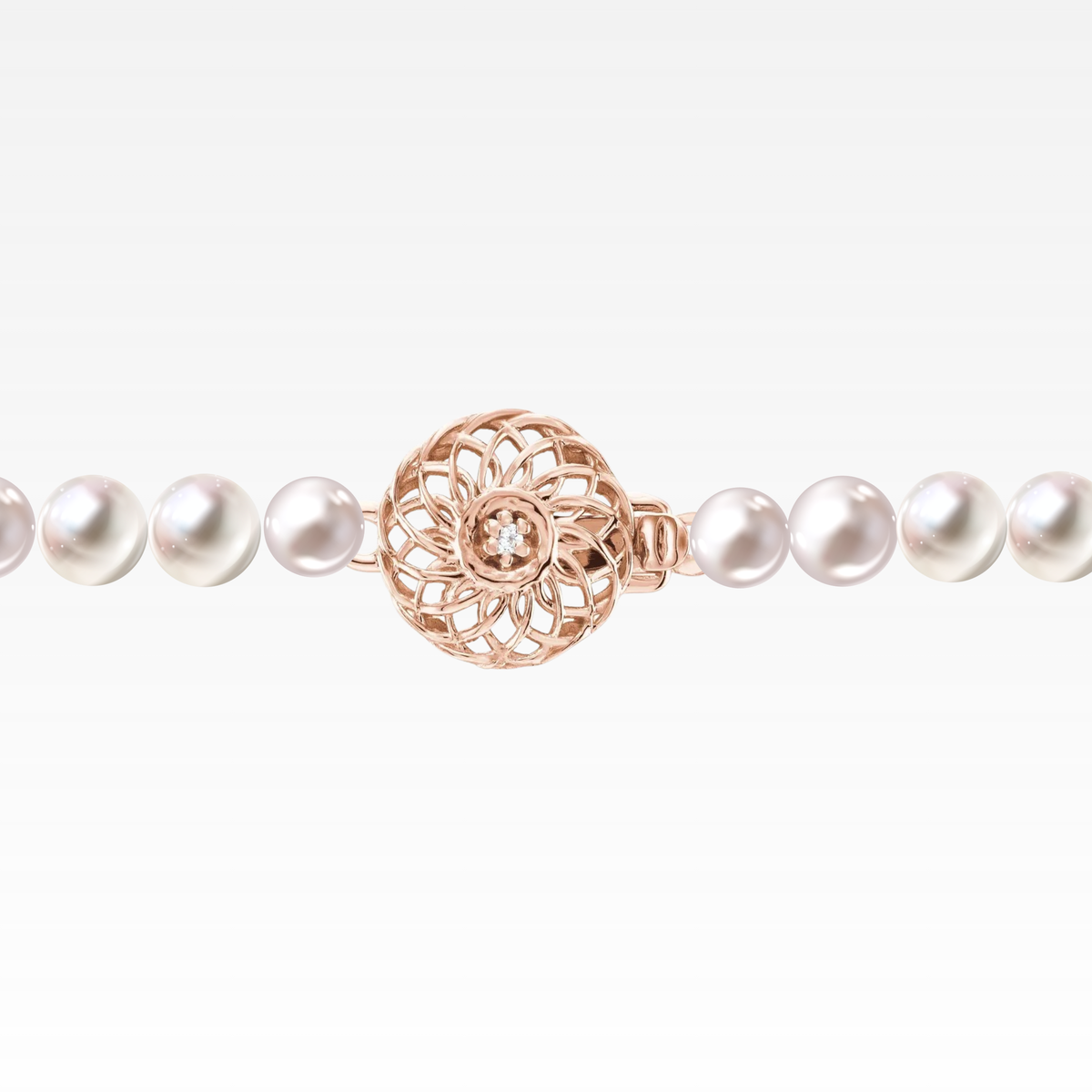 Pink ombré pearl necklace with a rose-gold clasp.