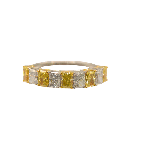White and yellow diamond ring with elegant beaded design.