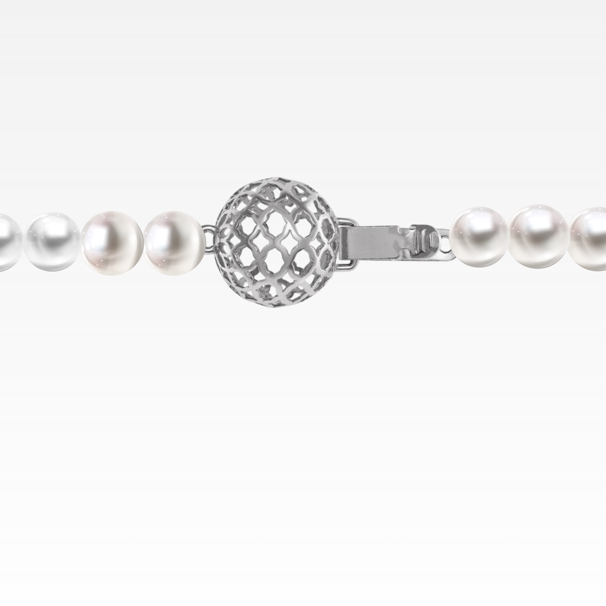 Cream pearl charm bracelet with white gold detailing.