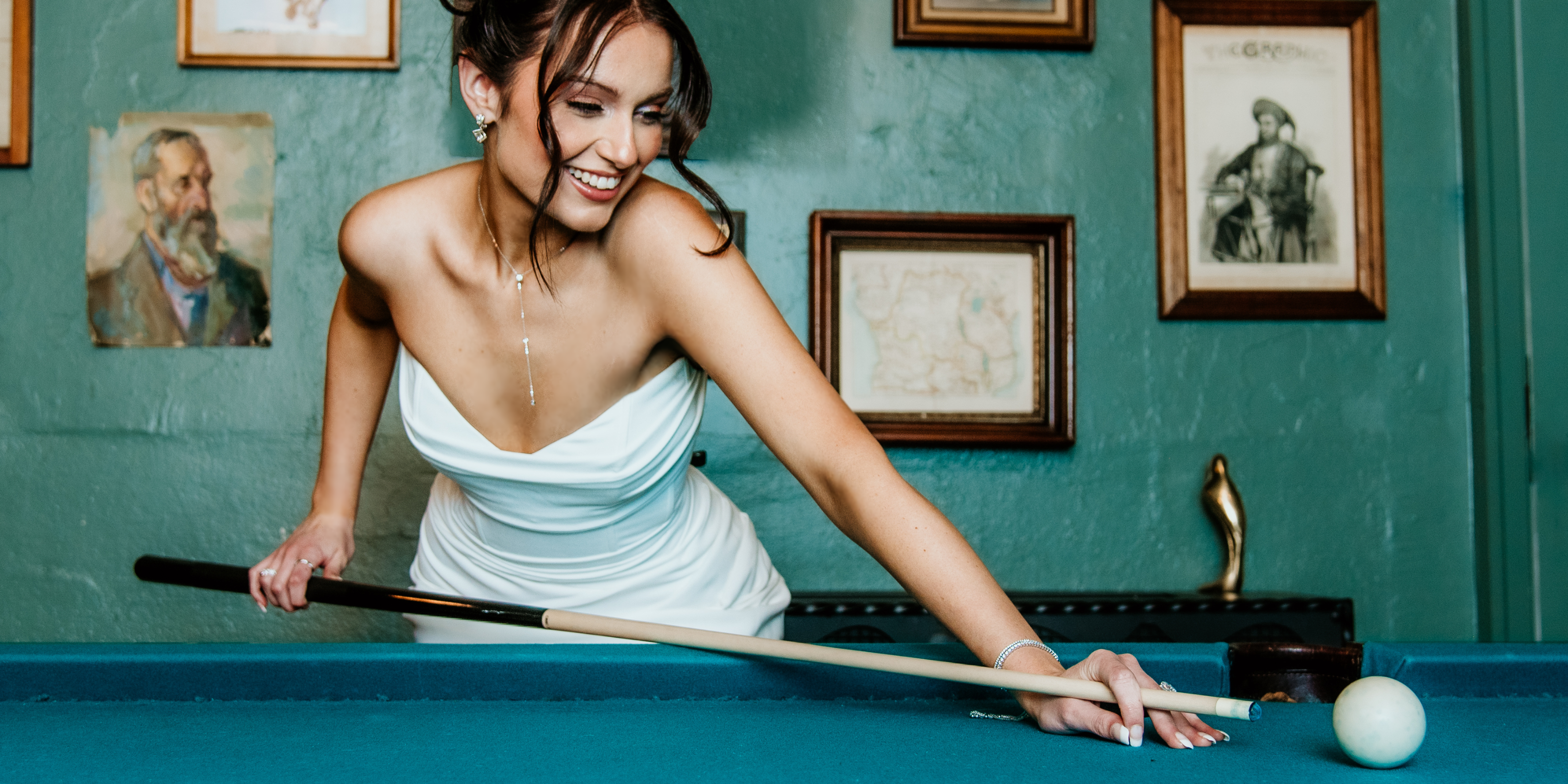 Bride leaning over a pool table in diamonds